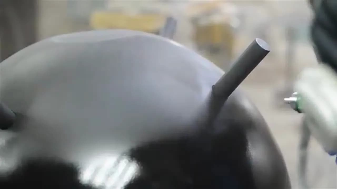 Шар в серой грунтовке с торчащим штырём